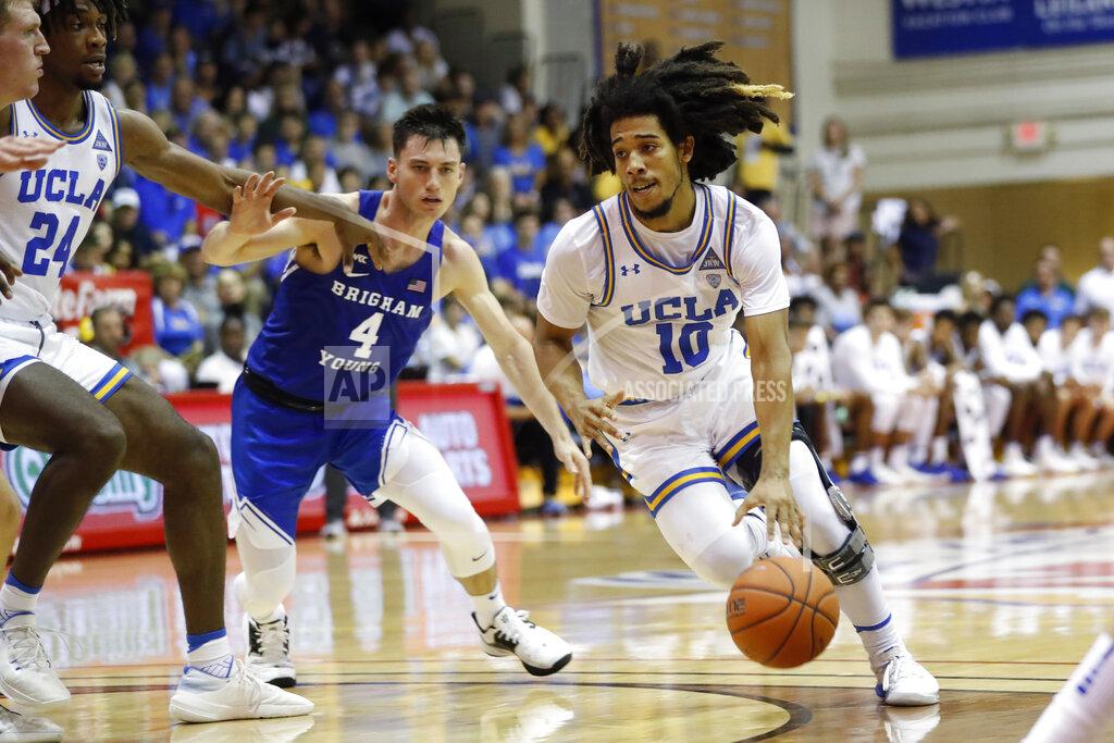 Marco Garcia UCLA guard Tyger Campbell (10) gets past BYU guard Alex Barcello (4) during the first half of an NCAA college basketball game, Monday, Nov. 25, 2019, in Lahaina, Hawaii. (AP Photo/Marco Garcia)