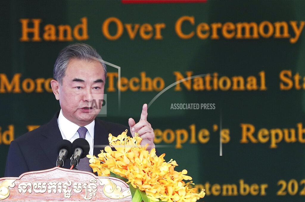 Lon Jadina Chinese Foreign Minister Wang Yi delivers a speech during a ceremony to hand over the Morodok Techo National Stadium to the the Cambodian organizing committee of the Southeast Asian Games, in Phnom Penh, Cambodia, Sunday, Sept. 12, 2021. Wang is visiting Cambodia, where's he expected to meet with Prime Minister Hun Sen and other officials to discuss COVID-19 and other regional issues. (Lon Jadina/Pool Photo via AP)