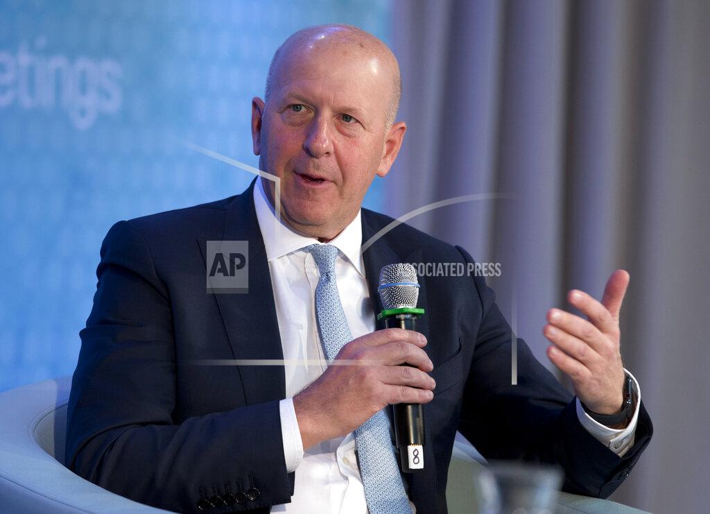 Jose Luis Magana FILE - In this Oct. 18, 2019 file photo, Chairman and CEO of Goldman Sachs David Solomon speaks during the World Bank/IMF Annual Meetings in Washington. New York's governor says he is "appalled" by videos showing crowds standing close together at a Hamptons concert featuring electronic music duo The Chainsmokers over the weekend. Gov. Andrew Cuomo said the state Department of Health will conduct an investigation into "egregious social distancing violations." The Saturday night concert on July 25, 2020, was billed as a charity drive-in show called "Safe & Sound" where Solomon and the Southampton town supervisor also performed. (AP Photo/Jose Luis Magana, File)