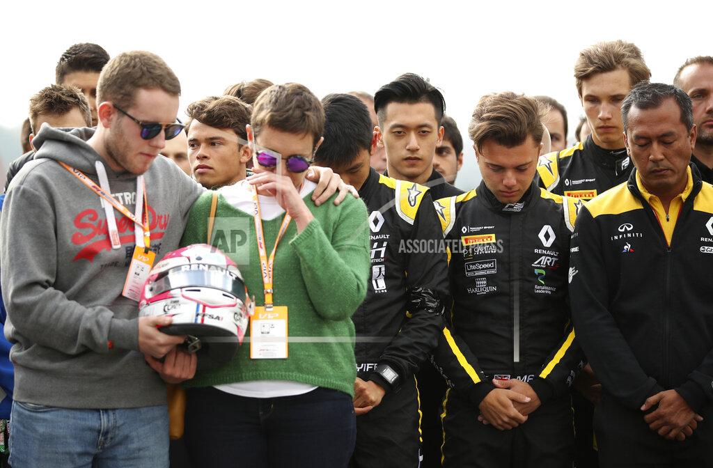 Francisco Seco The mother and brother of Anthoine Hubert hold the helmet of Formula 2 driver Anthoine Hubert during a moment of silence at the Belgian Formula One Grand Prix circuit in Spa-Francorchamps, Belgium, Sunday, Sept. 1, 2019. The 22-year-old Hubert died following an estimated 160 mph (257 kph) collision on Lap 2 at the high-speed Spa-Francorchamps track, which earlier Saturday saw qualifying for Sunday's Formula One race. (AP Photo/Francisco Seco)