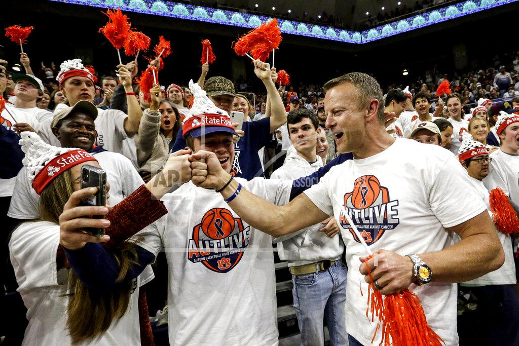 Butch Dill Auburn football coach Bryan Harsin greets fans during the first half of an NCAA college basketball game against Texas A&M Saturday, Feb. 12, 2022, in Auburn, Ala. Harsin was retained as head coach after an investigation. (AP Photo/Butch Dill)