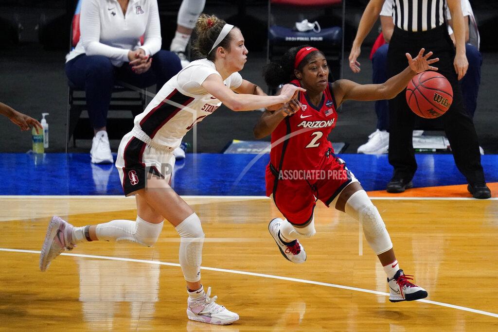 Eric Gay FILE - In this April 4, 2021, file photo, Arizona guard Aari McDonald (2) drives past Stanford guard Lexie Hull during the second half of the championship game in the NCAA women's college basketball tournament Final Four at the Alamodome in San Antonio. Atlanta chose McDonald in the WNBA draft Thursday, April 15. (AP Photo/Eric Gay, File)