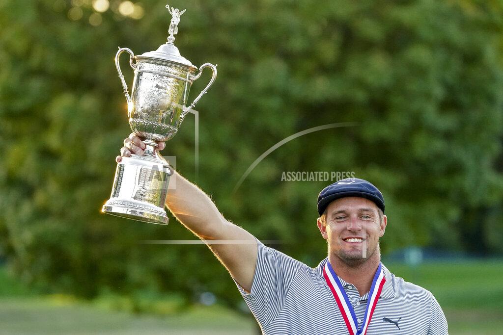 John Minchillo FILE - In this Sept. 20, 2020, file photo, Bryson DeChambeau holds up the winner's trophy after winning U.S. Open championship golf tournament in Mamaroneck, N.Y. Because of the pandemic, the Masters is being held in November (Nov. 12-15) for the first time. (AP Photo/John Minchillo, File)