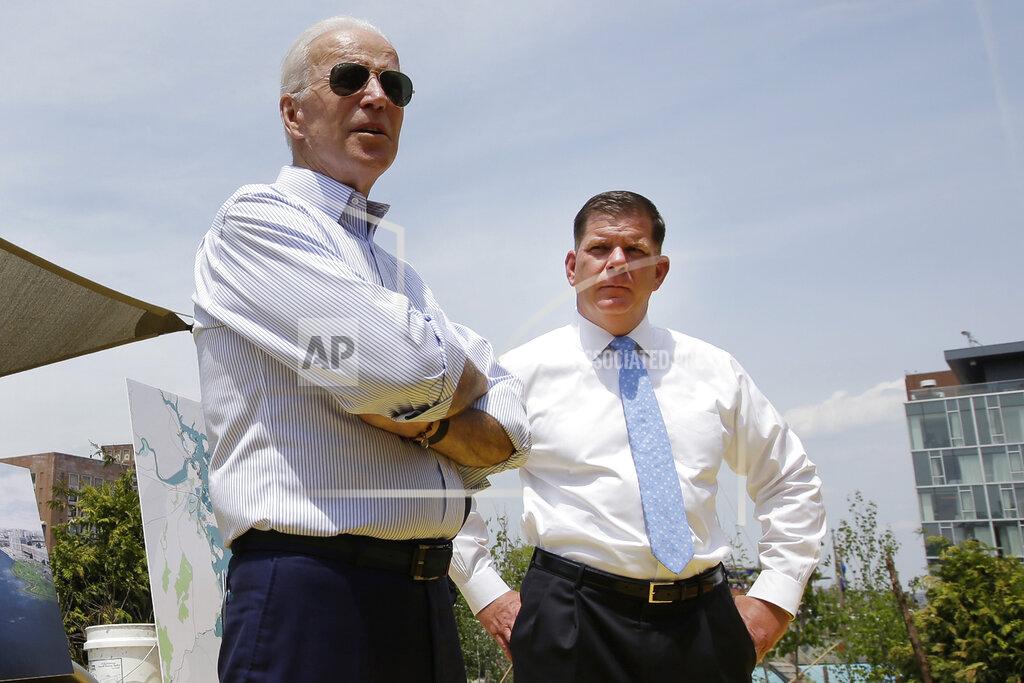 Steven Senne FILE - In this June 5, 2019, file photo, then- Democratic presidential candidate Joe Biden, led, stands with Boston Mayor Marty Walsh, right, during a campaign stop in Boston. Boston is facing a historic political pivot with the expected departure of Mayor Walsh to become President Joe Biden's labor secretary. (AP Photo/Steven Senne, File)