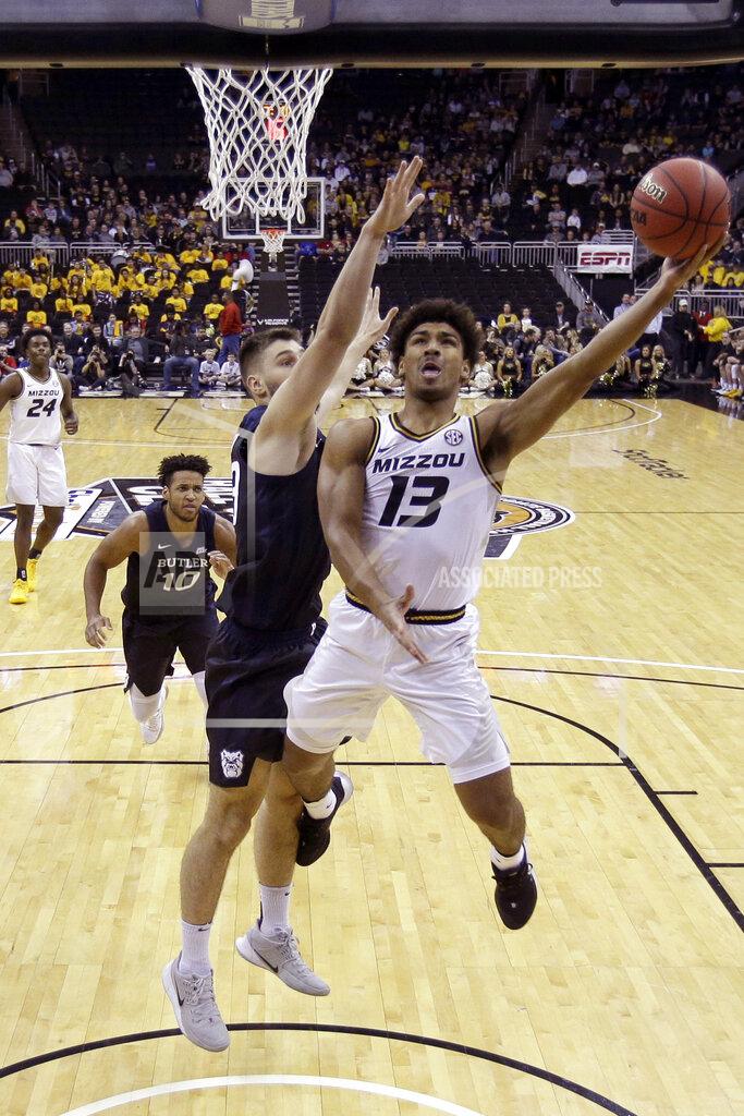 Charlie Riedel Missouri guard Mark Smith (13) shoots during the first half of an NCAA college basketball game against Butler, Monday, Nov. 25, 2019, in Kansas City, Mo. (AP Photo/Charlie Riedel)