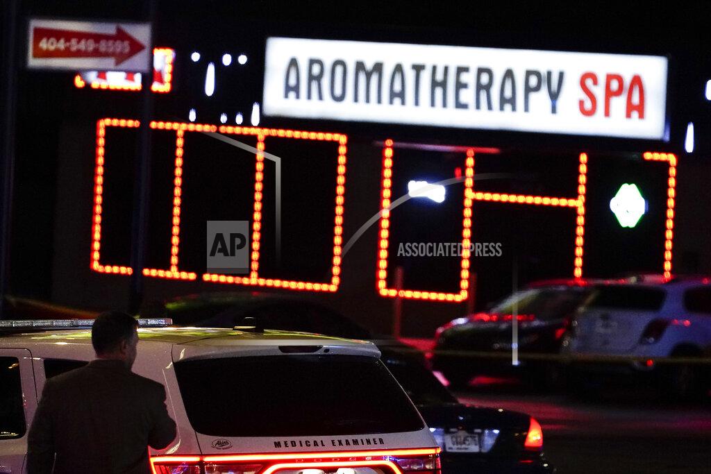 Brynn Anderson Officials stand in front of a massage parlor after a shooting, Tuesday, March 16, 2021, in Atlanta. Shootings at two massage parlors in Atlanta and one in the suburbs left multiple people dead, many of them women of Asian descent, authorities said. A 21-year-old man suspected in the shootings was taken into custody in southwest Georgia hours later after a manhunt, police said. (AP Photo/Brynn Anderson)