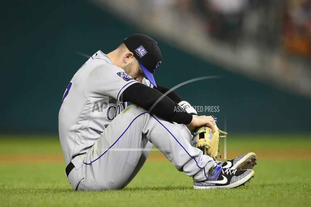 Nick Wass Colorado Rockies shortstop Trevor Story pauses on the field after he threw to first but was unable to put out Washington Nationals' Carter Kieboom during the fourth inning of a baseball game, Friday, Sept. 17, 2021, in Washington. (AP Photo/Nick Wass)