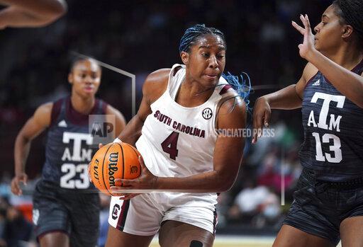 South Carolina forward Aliyah Boston (4) drives to the hoop against Texas A&M forward Jada Malone (13) during the first half of an NCAA college basketball game Thursday, Jan. 13, 2022, in Columbia, S.C. (AP Photo/Sean Rayford)