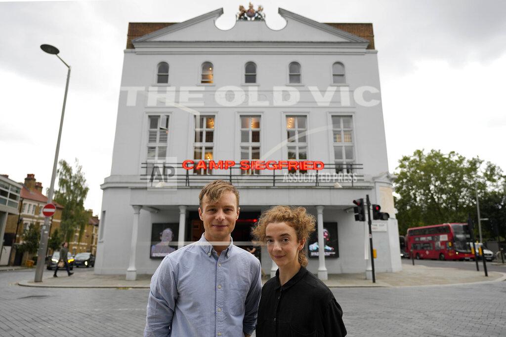 Frank Augstein Actors Patsy Ferran, right and Luke Thallon, stars of the play Camp Siegfried, pose for a photographer in front of the Old Vic theatre in London, Friday, Sept. 10, 2021. London's Old Vic Theatre is reopening at full capacity for the first time since the pandemic began. The show is “Camp Siegfried,” American writer Bess Wohl's play about a summer camp for Nazis on New York's Long Island. It's based on a real-life camp in the 1930s that indoctrinated young German-Americans into the ideas of the Third Reich, and depicts two teenagers whose burgeoning relationship collides with the insidious ideology of Nazism. (AP Photo/Frank Augstein)