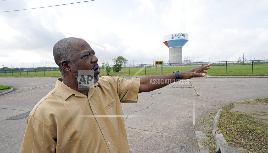 David J. Phillip Activist Hilton Kelley talks about the neighborhood where he grew up Monday, March 23, 2020, in Port Arthur, Texas. Kelley says he started speaking out for Port Arthur's black community when he got fed up "always hearing about someone dying of cancer, always smelling smells, watching little babies using nebulizers." (AP Photo/David J. Phillip)