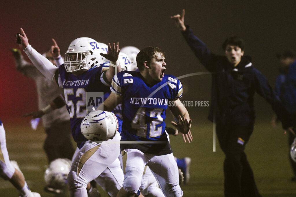 Kassi Jackson Newtown's Ben Pinto (42) reacts after the Newtown Nighthawks beat the Darien Blue Wave with a walk-off touchdown in the Class LL state football championship at Trumbull High School Saturday, Dec. 14, 2019, in Trumbull, Conn. Newtown won 13-7. Newtown marked the seventh anniversary of the massacre at Sandy Hook Elementary School with vigils, church services and a moment of joy when the community's high school football team, with a shooting victim's brother as linebacker, won the state championship Saturday in a last-minute thrill. (Kassi Jackson/Hartford Courant via AP)