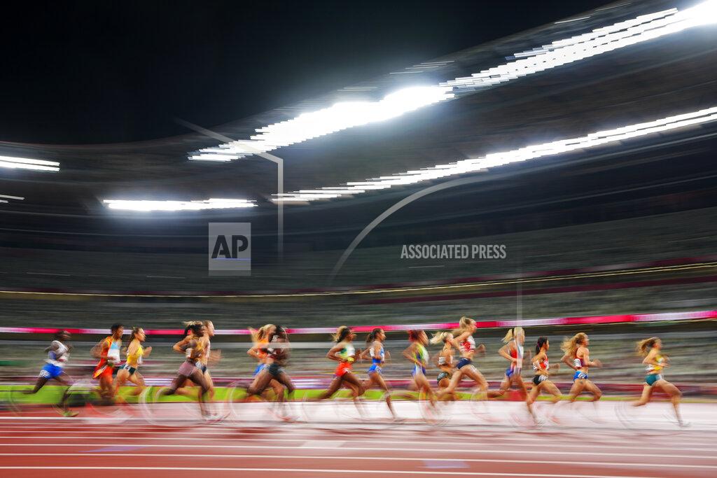 Petr David Josek Runners compete in a heat of the women's 5,000-meter run at the 2020 Summer Olympics, Friday, July 30, 2021, in Tokyo. (AP Photo/Petr David Josek)