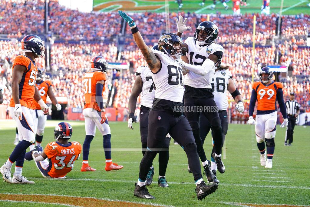 Jack Dempsey Jacksonville Jaguars tight end James O'Shaughnessy (80) reacts with teammates after scoring a touchdown during the second half of an NFL football game against the Denver Broncos, Sunday, Sept. 29, 2019, in Denver. (AP Photo/Jack Dempsey)