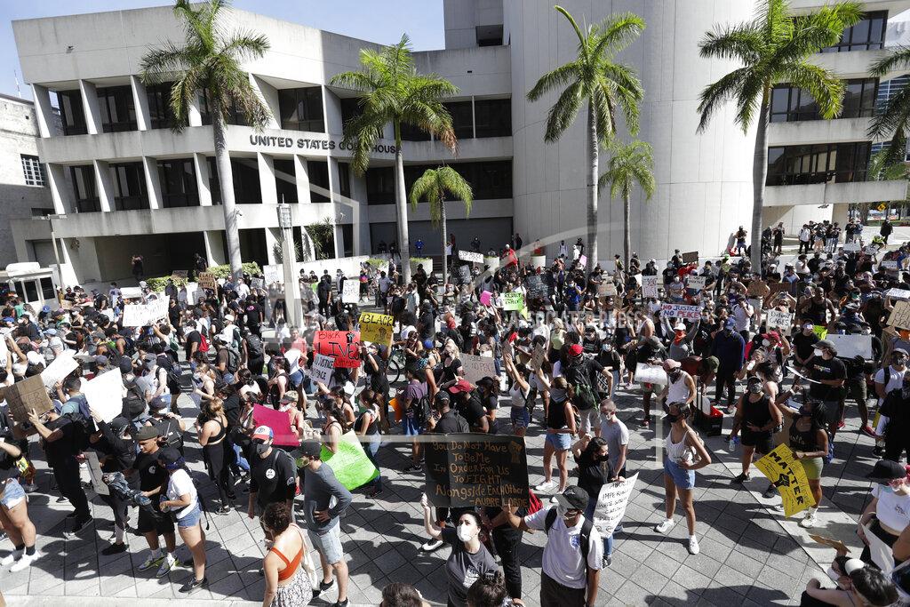 Wilfredo Lee Protesters demonstrate in the death of George Lloyd, Sunday, May 31, 2020, in front of the Federal Detention Center in downtown Miami. (AP Photo/Wilfredo Lee)