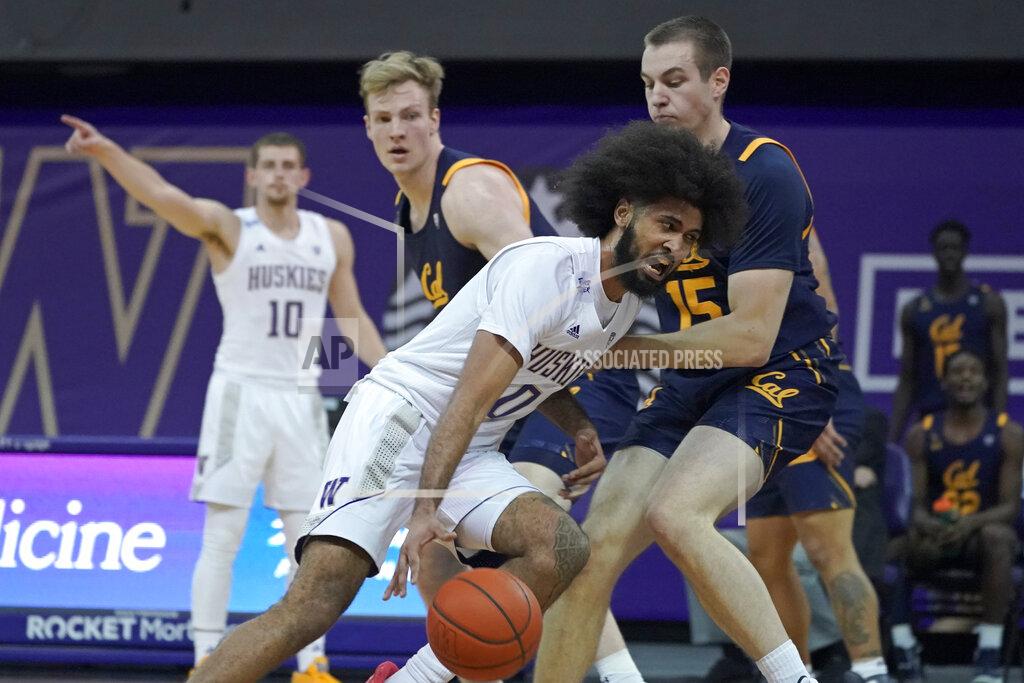 Ted S. Warren Washington guard Marcus Tsohonis (0) drives against forward Grant Anticevich (15) during the first half of an NCAA college basketball game Saturday, Feb. 20, 2021, in Seattle. (AP Photo/Ted S. Warren)