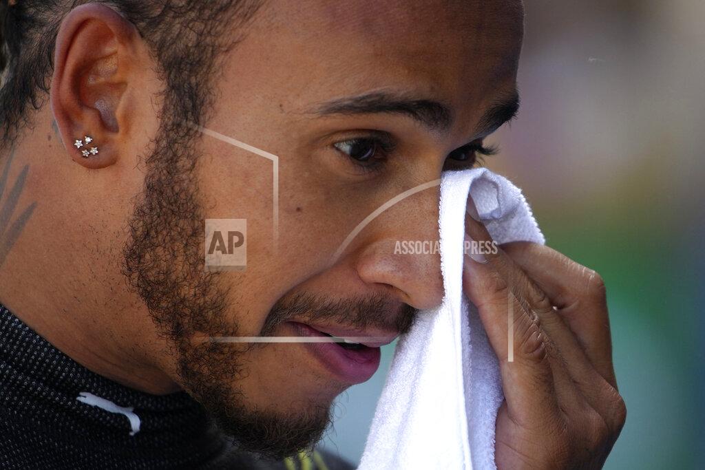 Emilio Morenatti Mercedes driver Lewis Hamilton of Britain wipes his face after cliched his 100th pole position by clocking the fastest time in the qualifying for the Spanish Formula One Grand Prix at the Barcelona Catalunya racetrack in Montmelo, just outside Barcelona, Spain, Saturday, May 8, 2021. The Spanish Grand Prix will be held on Sunday. (AP Photo/Emilio Morenatti, Pool)