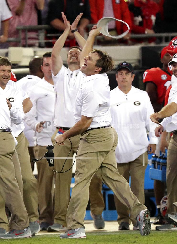 John Raoux Georgia head coach Kirby Smart, center, celebrates as he runs down the sideline during the final seconds defeating Florida 36-17 in an NCAA college football game Saturday, Oct. 27, 2018, in Jacksonville, Fla. (AP Photo/John Raoux)