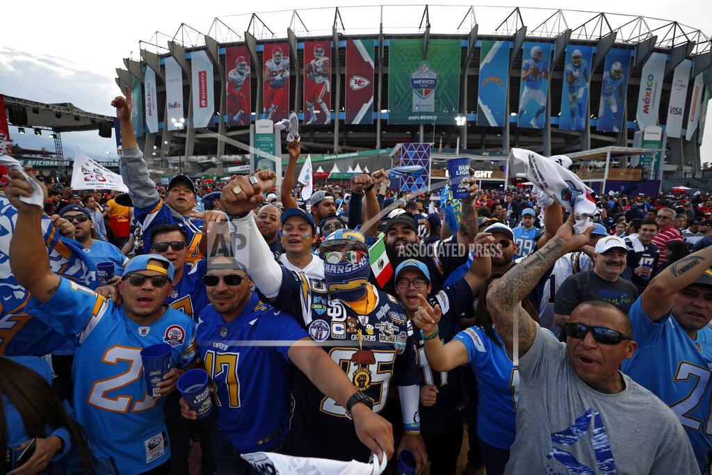 Rebecca Blackwell Fans cheer before an NFL football game between the Los Angeles Chargers and the Kansas City Chiefs Monday, Nov. 18, 2019, in Mexico City. (AP Photo/Rebecca Blackwell)