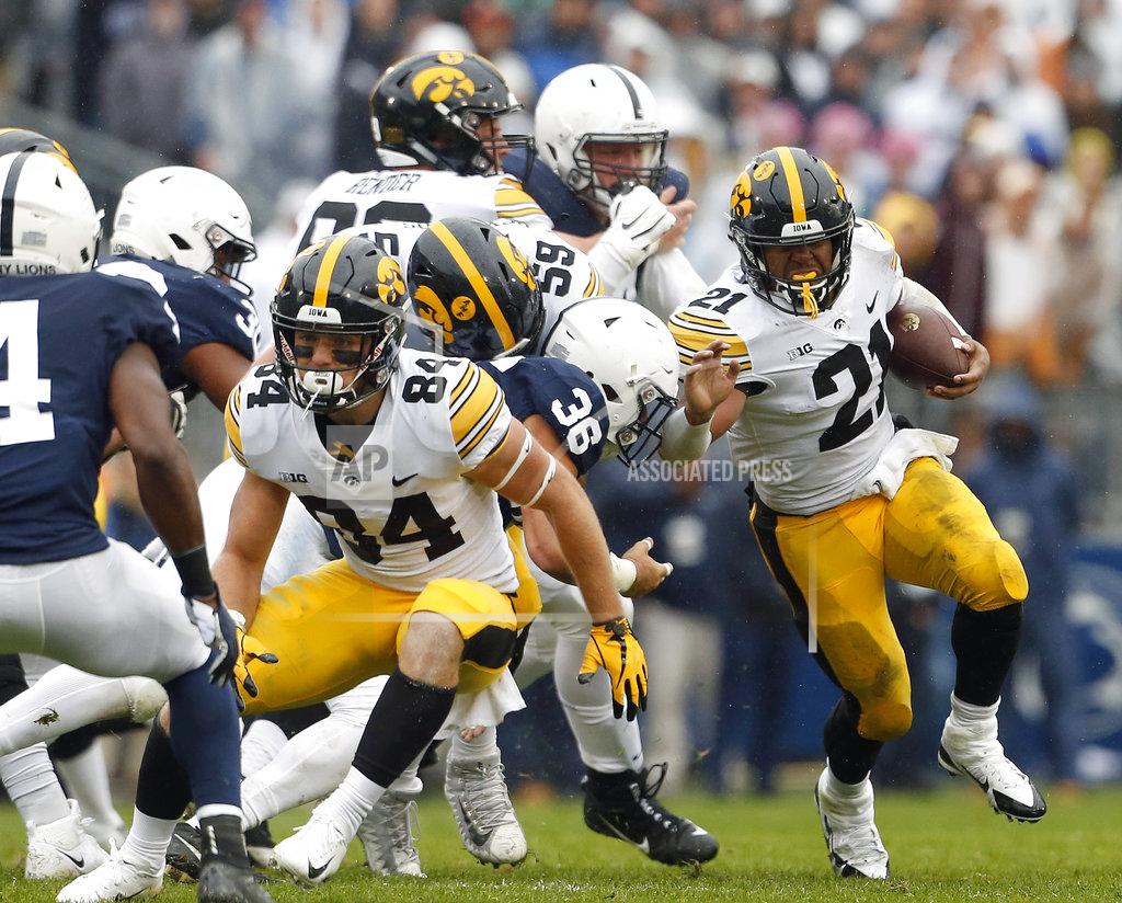 Chris Knight Iowa's Ivory Kelly-Martin (21) runs the ball against Penn State during the first half of an NCAA college football game in State College, Pa., Saturday, Oct. 27, 2018. (AP Photo/Chris Knight)