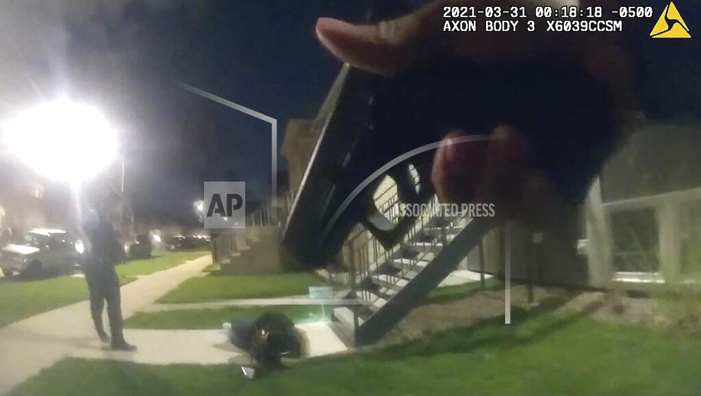 Uncredited In this image taken from Chicago Police body cam video from early Wednesday, March 31, 2021, Anthony Alvarez lies on the ground after a police foot chase in Chicago. Alvarez was fatally shot by police during the incident. Police claim Alvarez, 22, brandished a gun while being chased. (Civilian Office of Police Accountability via AP)