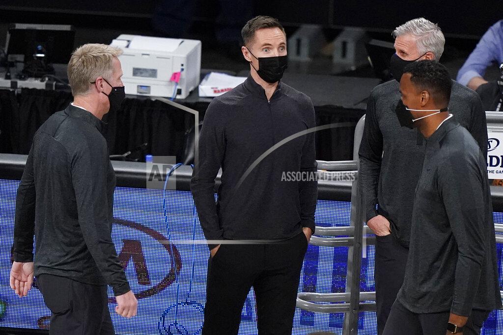 Kathy Willens Brooklyn Nets coach Steve Nash, center, talks with Golden State Warriors coach Steve Kerr, left, and other coaches before an NBA basketball game, Nash's debut in the regular season, Tuesday, Dec. 22, 2020, in New York. (AP Photo/Kathy Willens)