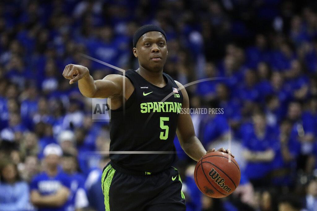 Adam Hunger Michigan State guard Cassius Winston directs his team against Seton Hall during the first half of an NCAA college basketball game Thursday, Nov. 14, 2019, in Newark, N.J. (AP Photo/Adam Hunger)