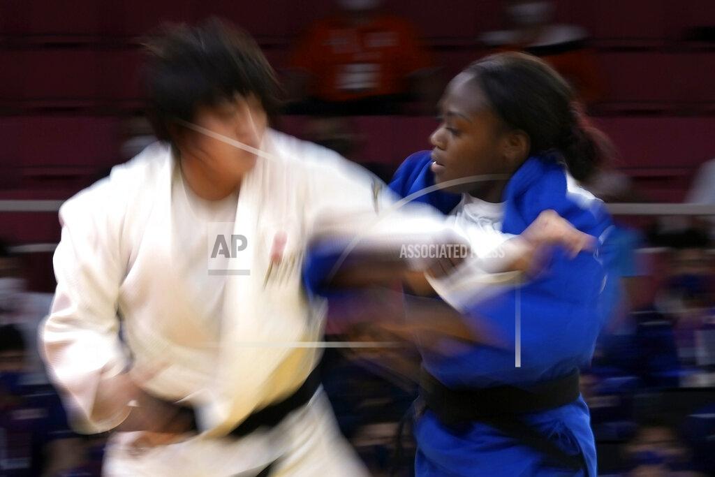 Vincent Thian Chizuru Arai, of Japan, left, and Clarisse Agbegnenou of France compete during their gold medal match in team judo competition at the 2020 Summer Olympics, Saturday, July 31, 2021, in Tokyo, Japan. (AP Photo/Vincent Thian)