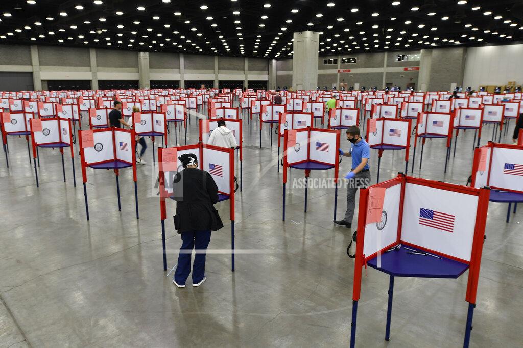 Timothy D. Easley Voting stations are set up in the South Wing of the Kentucky Exposition Center for voters to cast their ballot in the Kentucky primary in Louisville, Ky., Tuesday, June 23, 2020. In an attempt to prevent the spread of the coronavirus, neighborhood precincts were closed and voters that didn't cast mail in ballots were directed to one central polling location. (AP Photo/Timothy D. Easley)