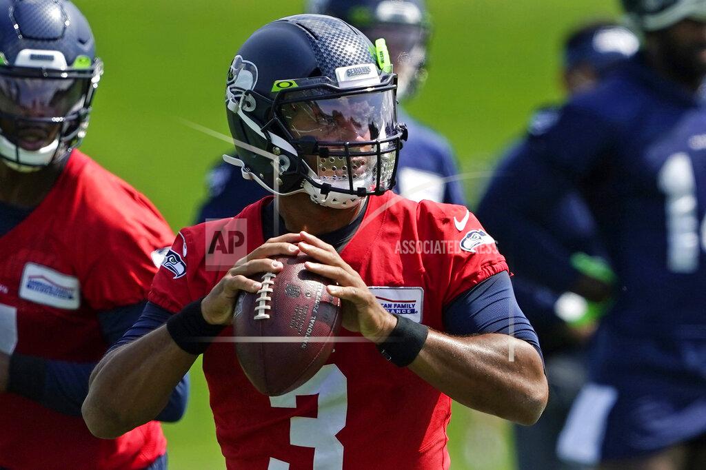 Ted S. Warren Seattle Seahawks quarterback Russell Wilson looks to pass during a practice drill at NFL football training camp, Wednesday, Aug. 12, 2020, in Renton, Wash. (AP Photo/Ted S. Warren, Pool)