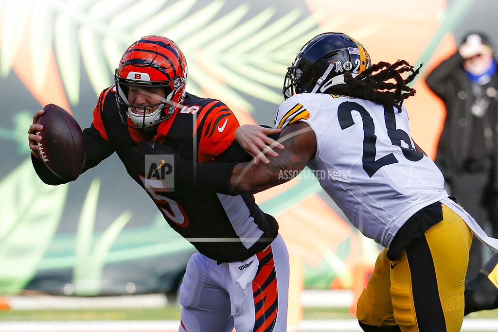 Frank Victores Cincinnati Bengals quarterback Ryan Finley (5) is sacked by Pittsburgh Steelers inside linebacker Mark Barron (26) during the first half an NFL football game, Sunday, Nov. 24, 2019, in Cincinnati. (AP Photo/Frank Victores)