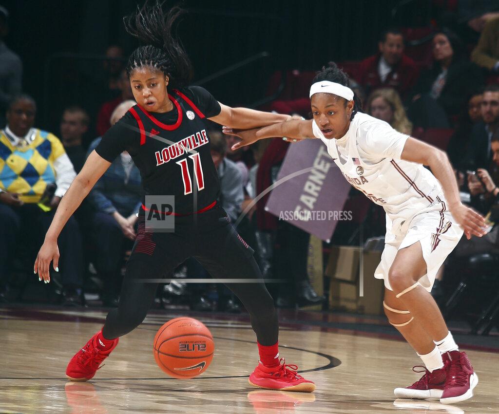 Phil Sears Louisville guard Arica Carter (11) and Florida State guard Nicole Ekhomu (12) go after a loose ball during the fourth quarter of an NCAA college basketball game in Tallahassee, Fla., Thursday, Jan. 24, 2019. (AP Photo/Phil Sears)