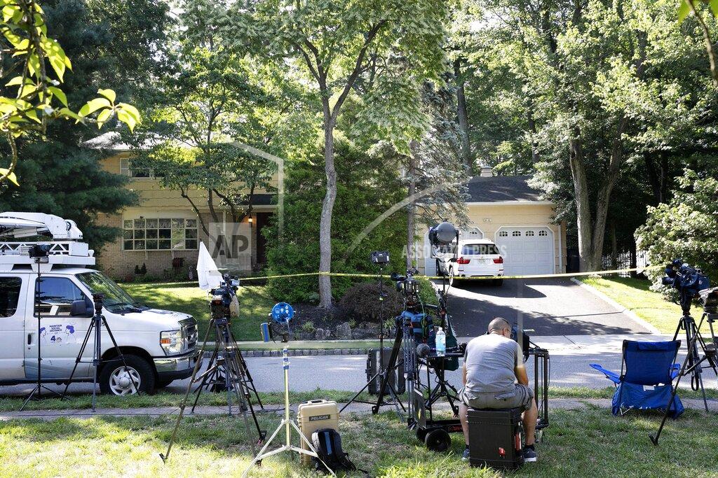 Mark Lennihan FILE - In this July 20, 2020, file photo, news media is set up in front of the home of U.S. District Judge Esther Salas in North Brunswick, N.J. (AP Photo/Mark Lennihan, File)