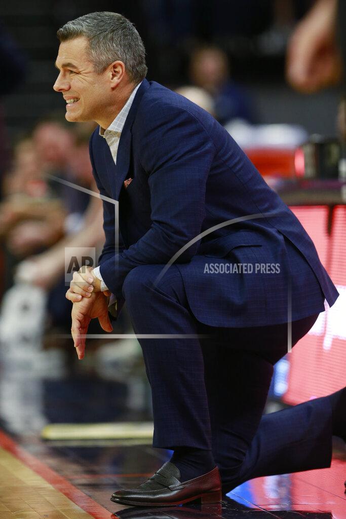 Steve Helber Virginia head coach Tony Bennett watches play during the first half of an NCAA college basketball game against Syracuse in Charlottesville, Va., Saturday, Jan. 11, 2020. (AP Photo/Steve Helber)