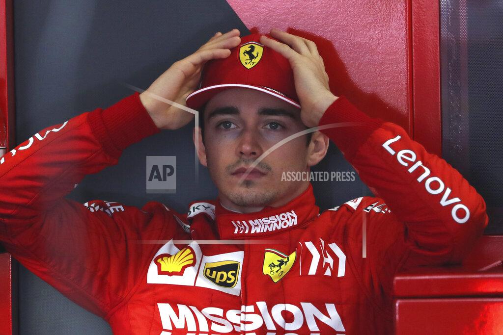 Ng Han Guan Ferrari driver Charles Leclerc of Monaco prepares for the first practice session of the Chinese Formula One Grand Prix at the Shanghai International Circuit in Shanghai on Friday, April 12, 2019. (AP Photo/Ng Han Guan)