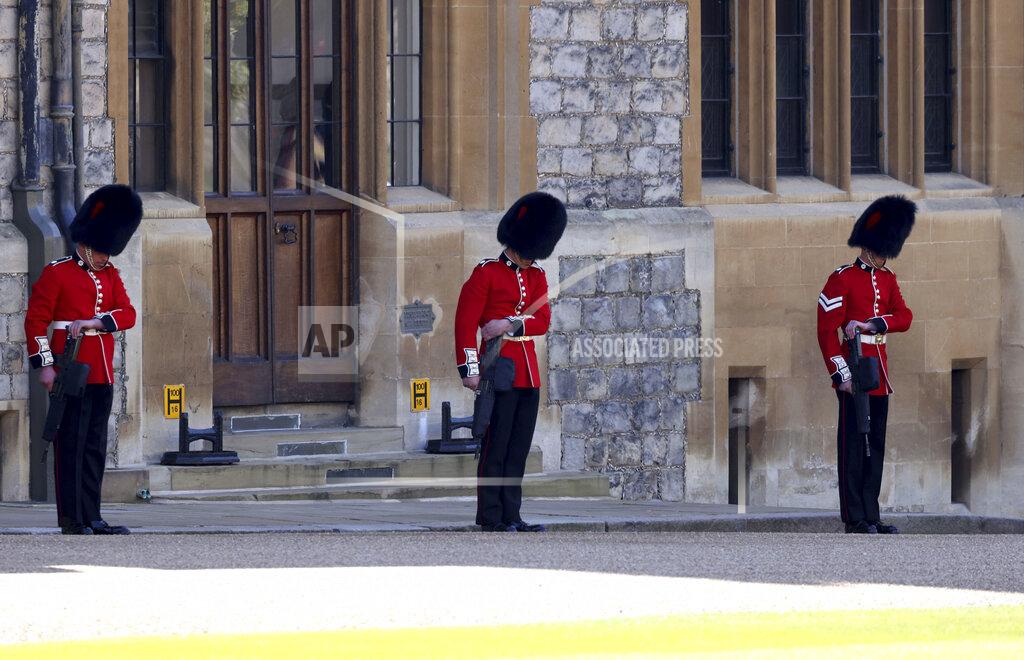 Johnathan Buckmaster Members of the military line the Quadrangle as they wait the arrival of the coffin carrying The Duke of Edinburgh, ahead of his funeral at Windsor Castle, Windsor, England, Saturday April 17, 2021. Prince Philip died April 9 at the age of 99 after 73 years of marriage to Britain's Queen Elizabeth II. (Johnathan Buckmaster/Pool via AP)
