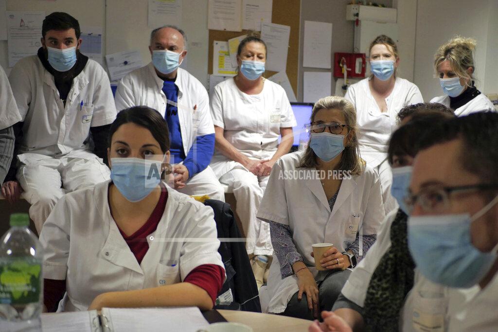 Thibault Camus Ward's chief psychiatrist, Sandrine Elias, center right, attends a team meeting with medical staff at the emergency ward of the Rouvray psychiatric hospital, in Rouen, western France, Wednesday, Nov. 25, 2020. Lockdowns that France has used to fight the coronavirus have come at considerable cost to mental health. Surveying points to a surge of depression most acute among people without work, in financial hardship and young adults. (AP Photo/Thibault Camus)