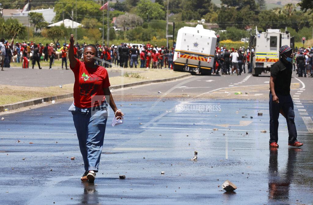 Nardus Engelbrecht Members of the Economic Freedom Fighters (EFF) protest near the Brackenfell High school in Cape Town, South Africa, Friday, Nov. 20, 2020. The EFF party organized protests at the school in response to a students' prom they claim only white kids were invited to. (AP Photo/Nardus Engelbrecht)