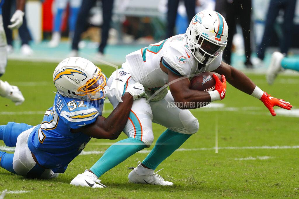 Wilfredo Lee Los Angeles Chargers defensive end Melvin Ingram (54) tackles Miami Dolphins running back Mark Walton (22), during the first half at an NFL football game, Sunday, Sept. 29, 2019, in Miami Gardens, Fla. AP Photo/Wilfredo Lee)
