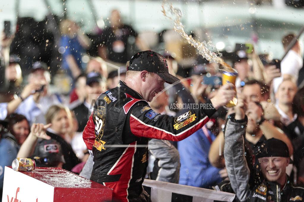 Luis M. Alvarez Tyler Reddick celebrates in Victory Lane after winning the NASCAR Xfinity Series auto racing championship at Homestead-Miami Speedway in Homestead, Fla. Saturday, Nov. 16, 2019. (AP Photo/Luis M. Alvarez)