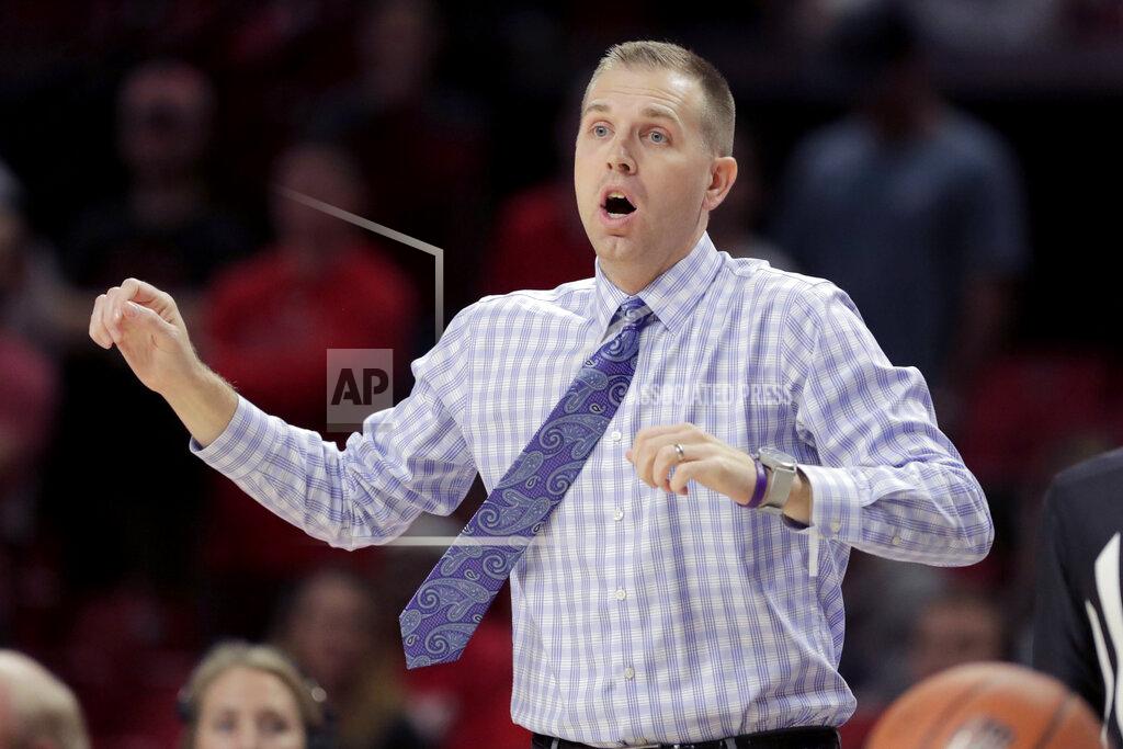 Julio Cortez Holy Cross head coach Brett Nelson looks on during the first half of an NCAA college basketball game against Maryland, Tuesday, Nov. 5, 2019, in College Park, Md. (AP Photo/Julio Cortez)
