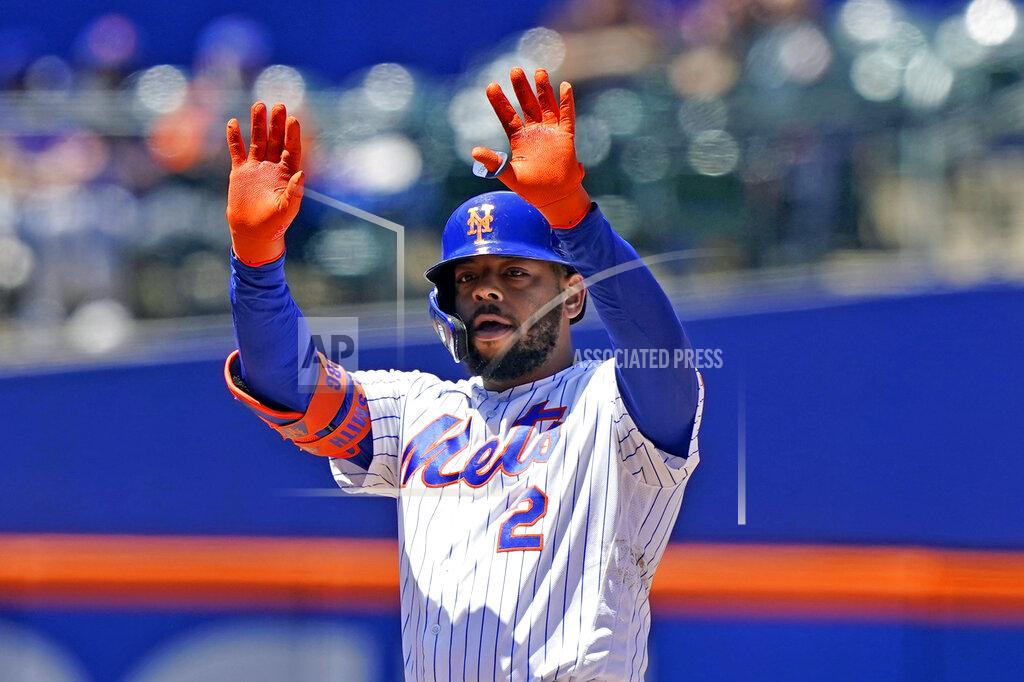 Kathy Willens New York Mets' Dominic Smith (2) gestures to fans and teammates after hitting a RBI double during the fifth inning of a baseball game against the Baltimore Orioles, Wednesday, May 12, 2021, in New York. (AP Photo/Kathy Willens)