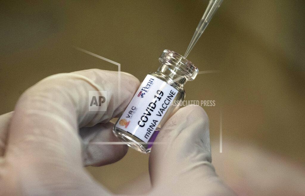 Sakchai Lalit FILE - In this May 25, 2020, file photo, a lab technician extracts a portion of a COVID-19 vaccine candidate during testing at the Chula Vaccine Research Center, run by Chulalongkorn University in Bangkok, Thailand. As the race for a vaccine against the new coronavirus intensifies, many rich countries are rushing to the front of the line by placing advance orders for the inevitably limited supply to guarantee their citizens are immunized first. (AP Photo/Sakchai Lalit, File)