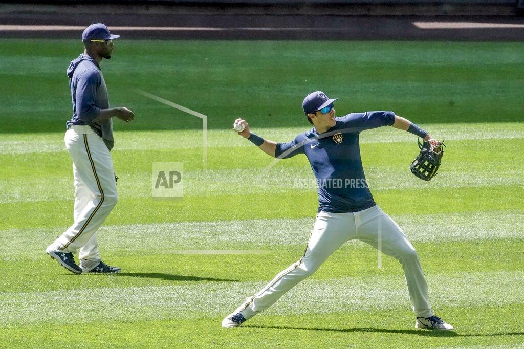 Morry Gash Milwaukee Brewers' Christian Yelich throws during a practice session Monday, July 13, 2020, at Miller Park in Milwaukee. (AP Photo/Morry Gash)
