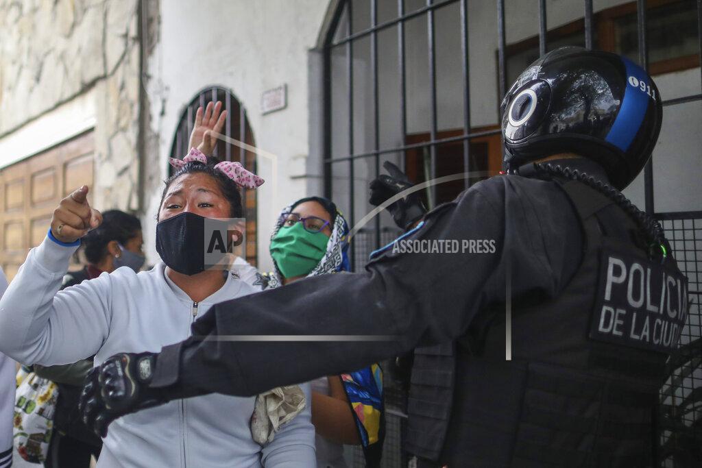 Natacha Pisarenko Relatives of inmates gather outside the Villa Devoto prison in Buenos Aires, Argentina, Friday, April 24, 2020. Riots broke out inside the prison as inmates protest that authorities are not doing enough to prevent the spread of coronavirus inside the prison. (AP Photo/Natacha Pisarenko)