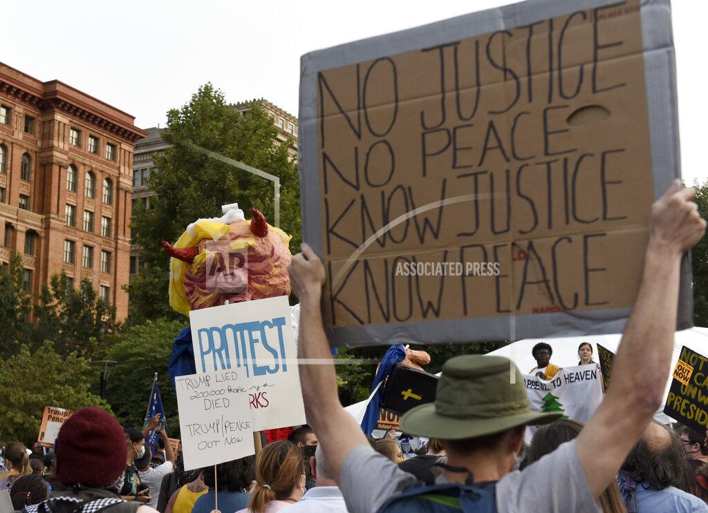Michael Perez People gather at Independence Mall to protest U.S. President Donald Trump as he visits the National Constitution Center to participate in the ABC News town hall, Tuesday, Sept. 15, 2020, in Philadelphia. (AP Photo/Michael Perez)