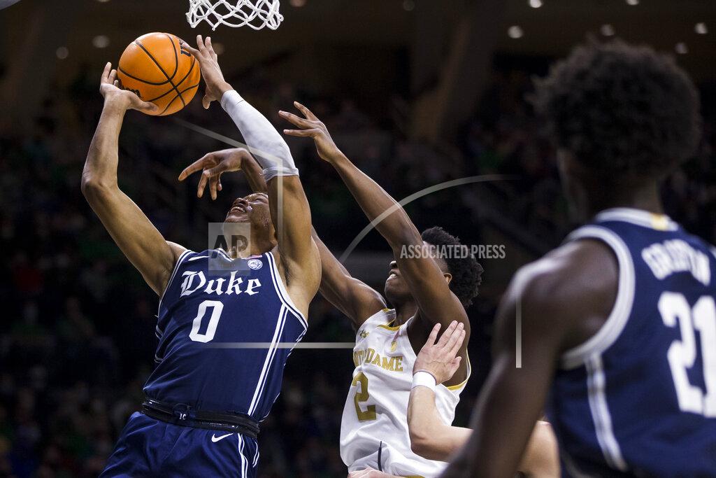Robert Franklin Duke's Wendell Moore Jr. (0) goes up for a shot with pressure from Notre Dame's Trey Wertz (2) during the first half of an NCAA college basketball game Monday, Jan. 31, 2022, in South Bend, Ind. (AP Photo/Robert Franklin)