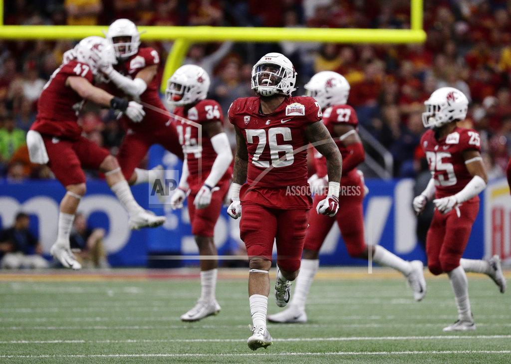 Eric Gay Washington State defensive back Hunter Dale (26) and teammates celebrate a fumble recovery in the second half of the Alamo Bowl NCAA college football game against Iowa State, Friday, Dec. 28, 2018, in San Antonio. (AP Photo/Eric Gay)