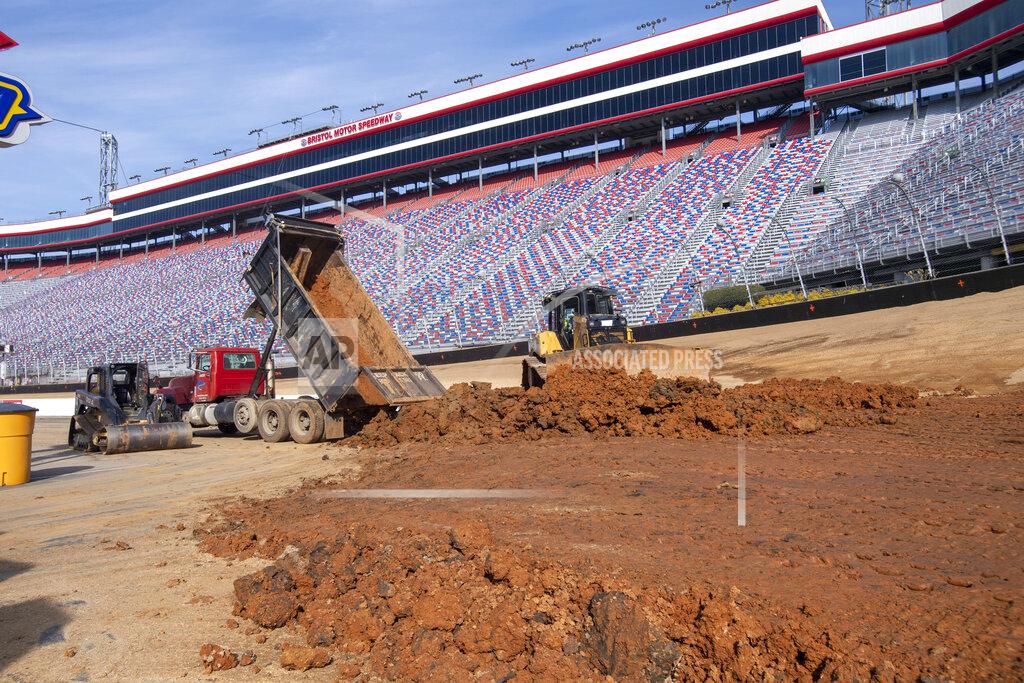 David Crigger FILE - Workers turn Bristol Motor Speedway into a dirt track, in Bristol, Tenn., in this Thursday, Jan. 14, 2021, file photo. Bristol, once one of the toughest tickets in sports, trucked 23,000 cubic yards of dirt into its famed bullring to transform the facility and host NASCAR's first Cup race on dirt in 70 years on Sunday, March 28. (David Crigger/Bristol Herald Courier via AP, FIle)\