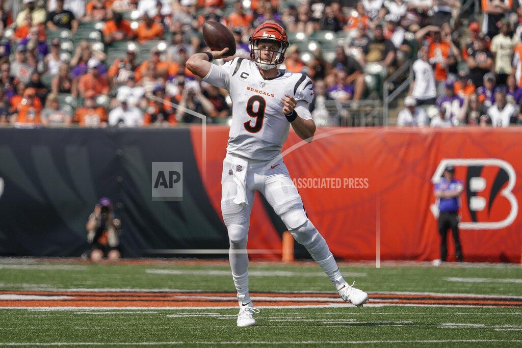 Cincinnati Bengals quarterback Joe Burrow (9) passes against the Minnesota Vikings during the second half of an NFL football game, Sunday, Sept. 12, 2021, in Cincinnati. (AP Photo/Jeff Dean)