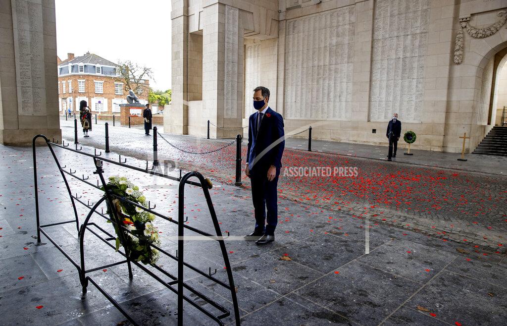 Kurt Desplenter Belgium's Prime Minister Alexander De Croo takes a moment of silence after placing a wreath during an Armistice Day ceremony at the Menin Gate Memorial to the Missing in Ypres, Belgium, Wednesday, Nov. 11, 2020. Due to coronavirus restrictions the general public was not permitted to attend the ceremony under the Menin Gate, with dignitary attendance reduced to a minimum. (Kurt Desplenter, Pool via AP)